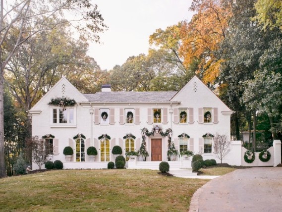Breathtaking white brick French Country home decorated for Christmas